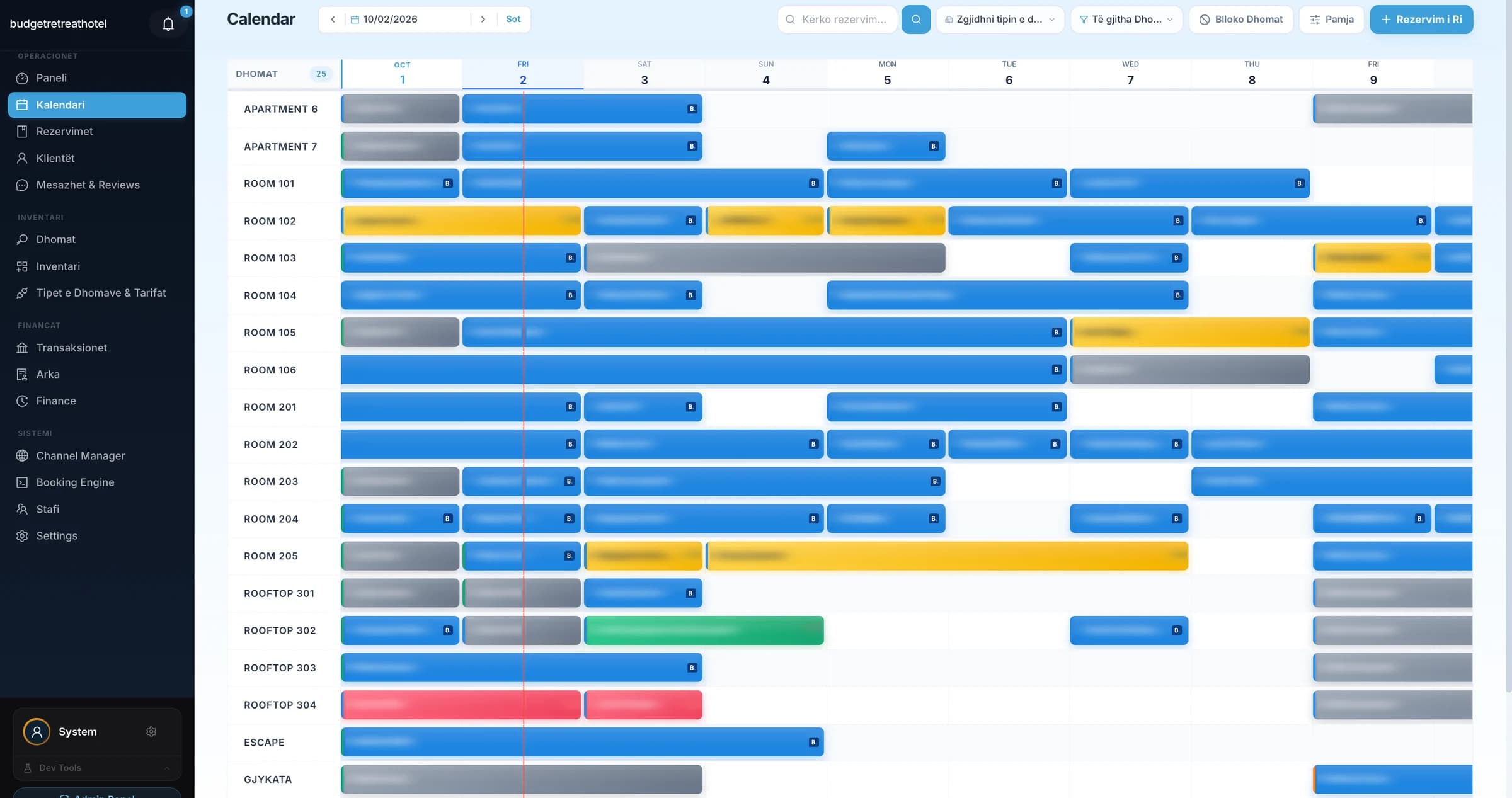 The LuxHotel reservation calendar with bookings coloured by channel: Booking.com in blue, Expedia in yellow, walk-ins in grey